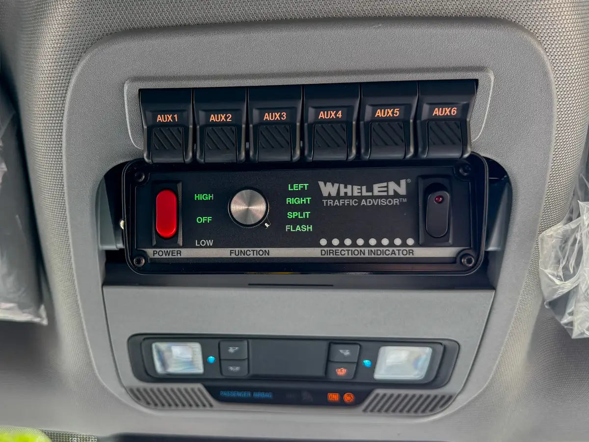 Rear bench-seat interior view with seatbacks and rear floor area.